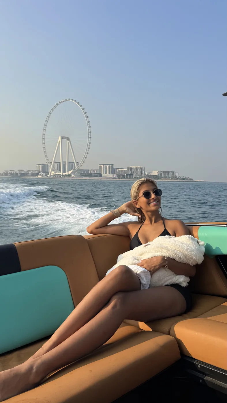 Zay relaxing on boat with baby